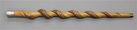 An Asian carved wooden serpent walking stick, 33in.